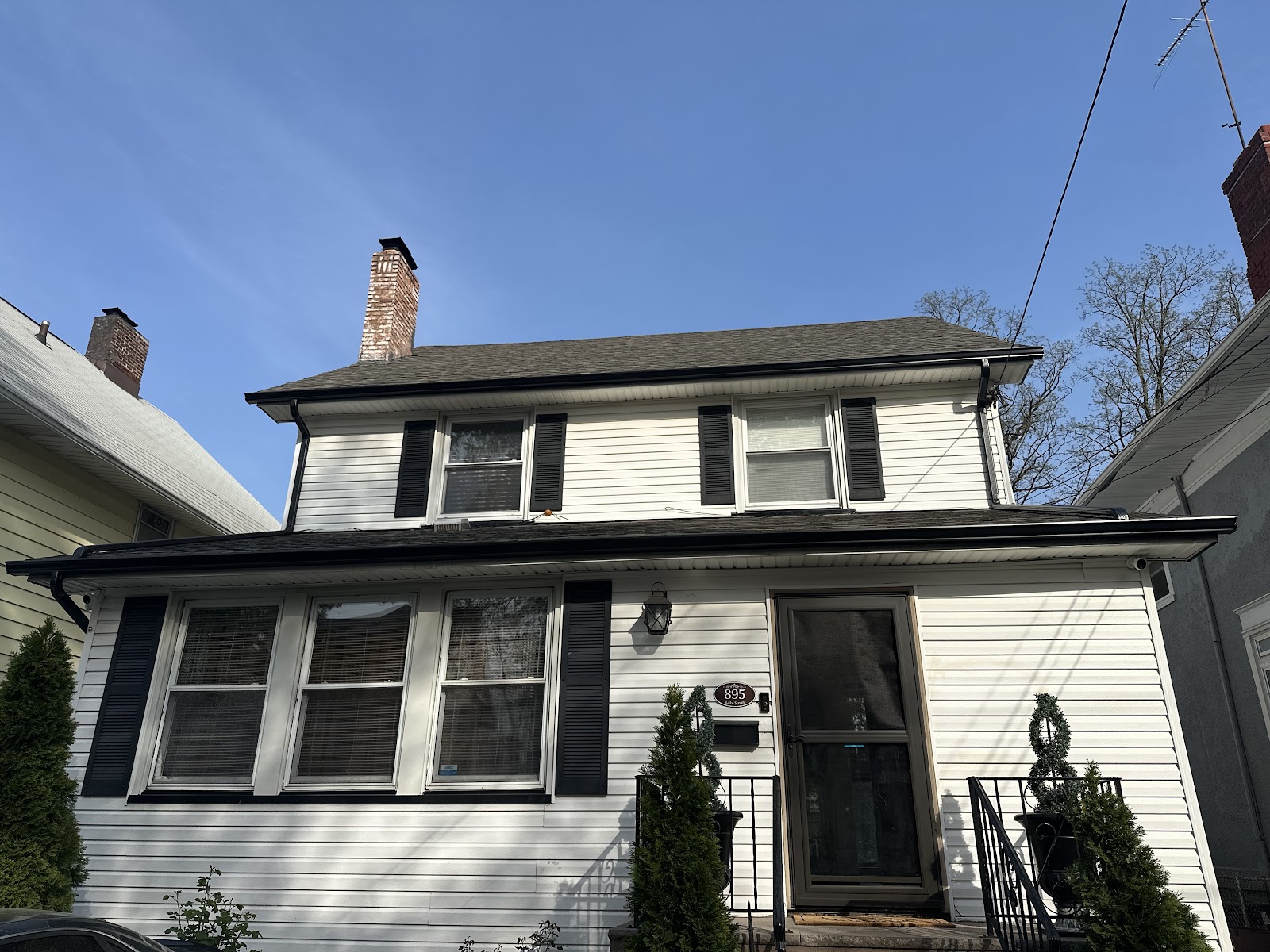 Home with new gutters and downspout at the front corner