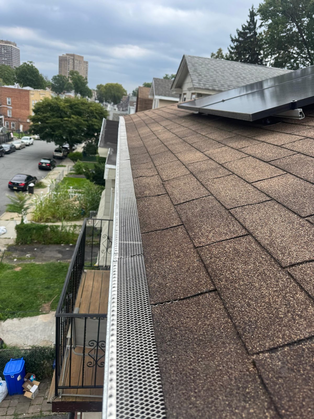 Mesh gutter guard keeping leaves out of a home's gutter channel